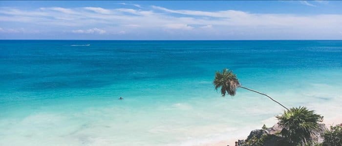 Clear blue waters and white sand beach