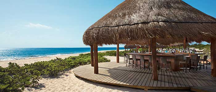 Chill down at the beach cabana bar for free drinks and some fun